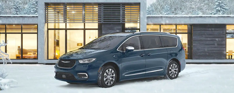 Fathom Blue Chrysler Pacifica parked in the snow