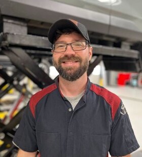 Staff member Brandon Abbott from ID_243965