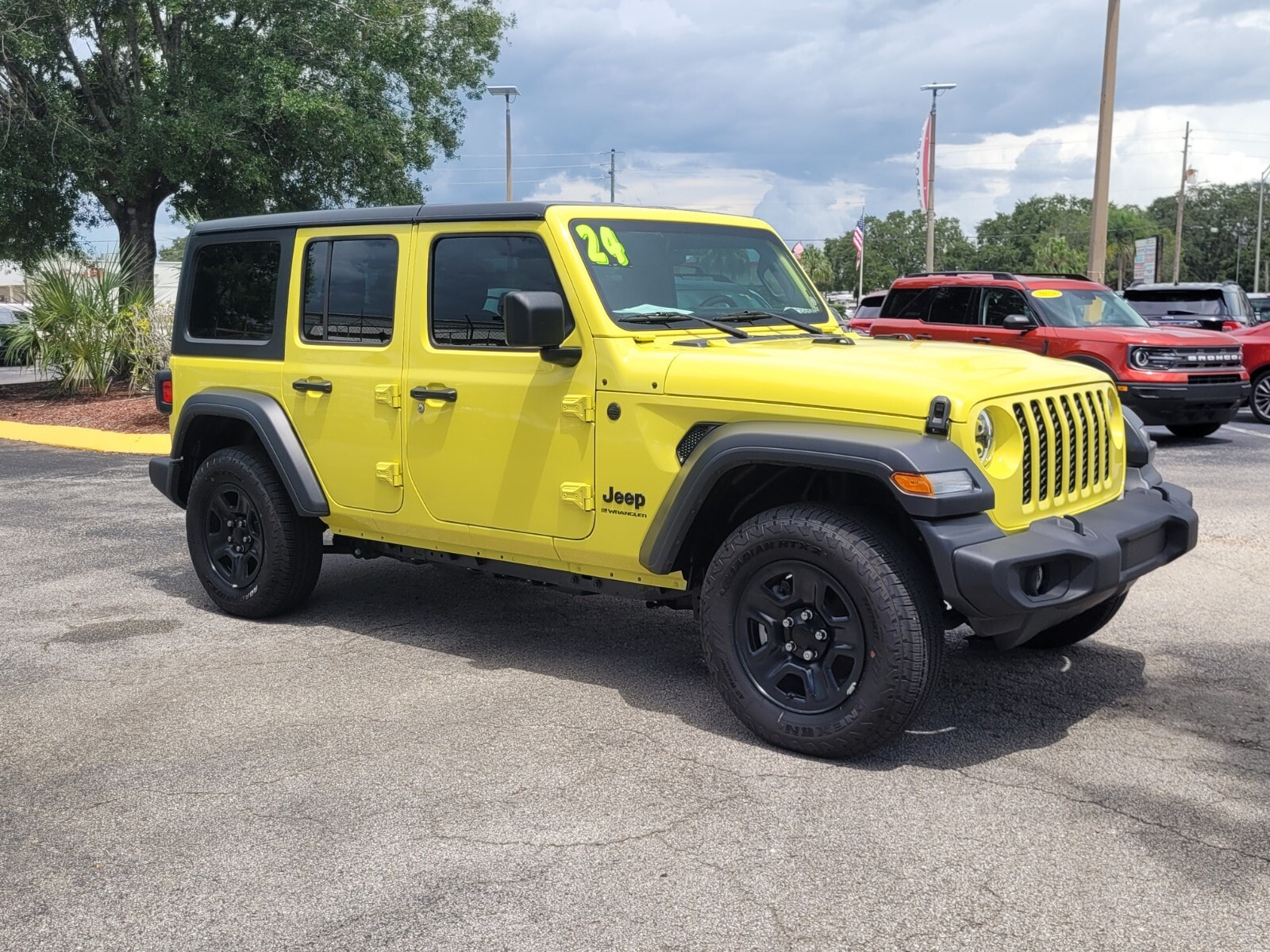 Used 2024 Jeep Wrangler 4-Door Sport with VIN 1C4PJXDNXRW110395 for sale in Sebring, FL