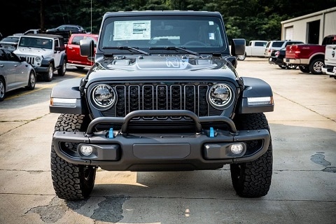 black jeep wrangler 4xe parked at All American CDJR in Oneonta, AL
