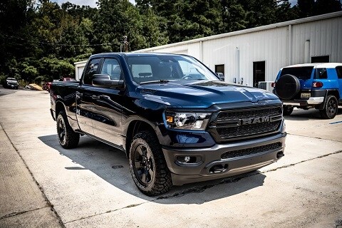 black ram 1500 parked at a dealership in oneonta, al