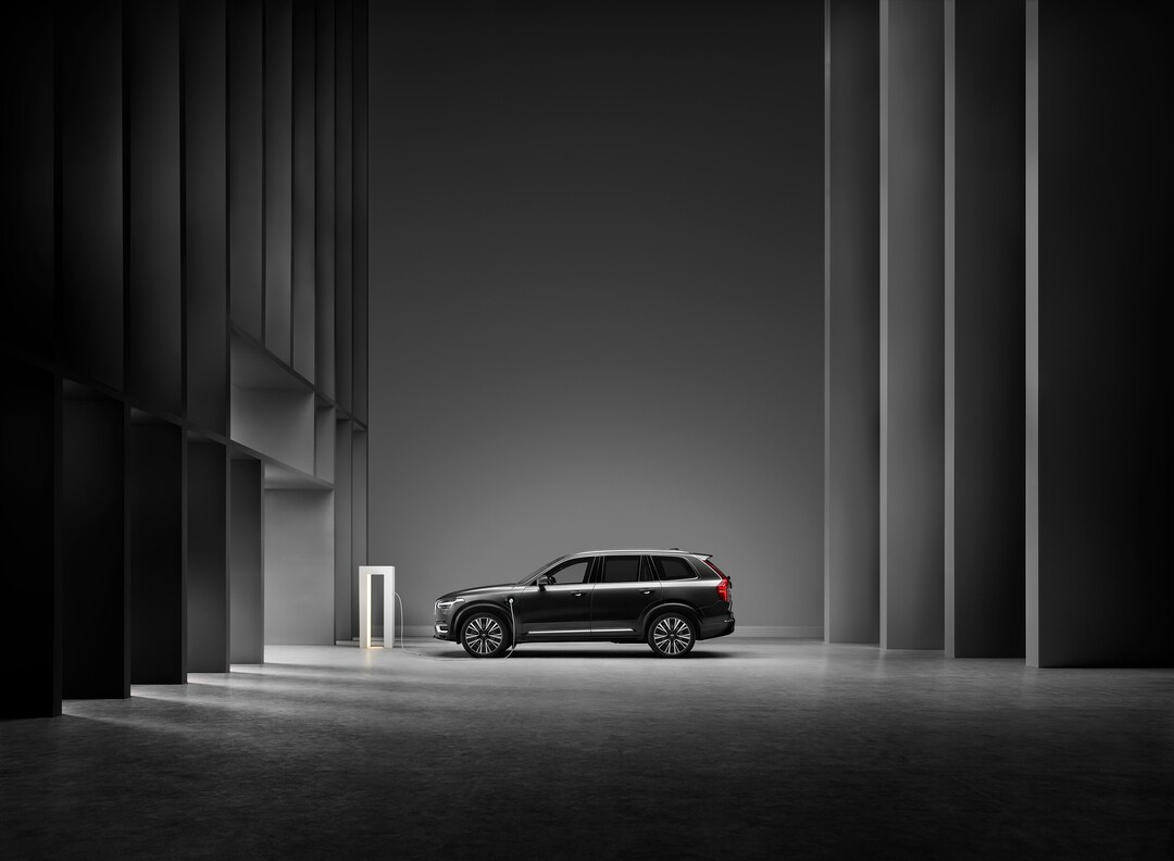  Person cheerfully signing documents.