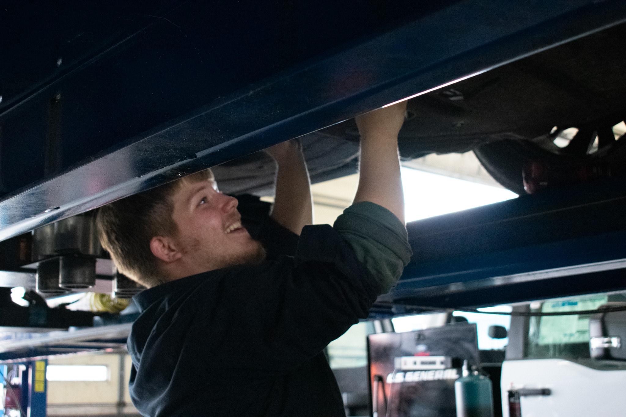  Person cheerfully signing documents.