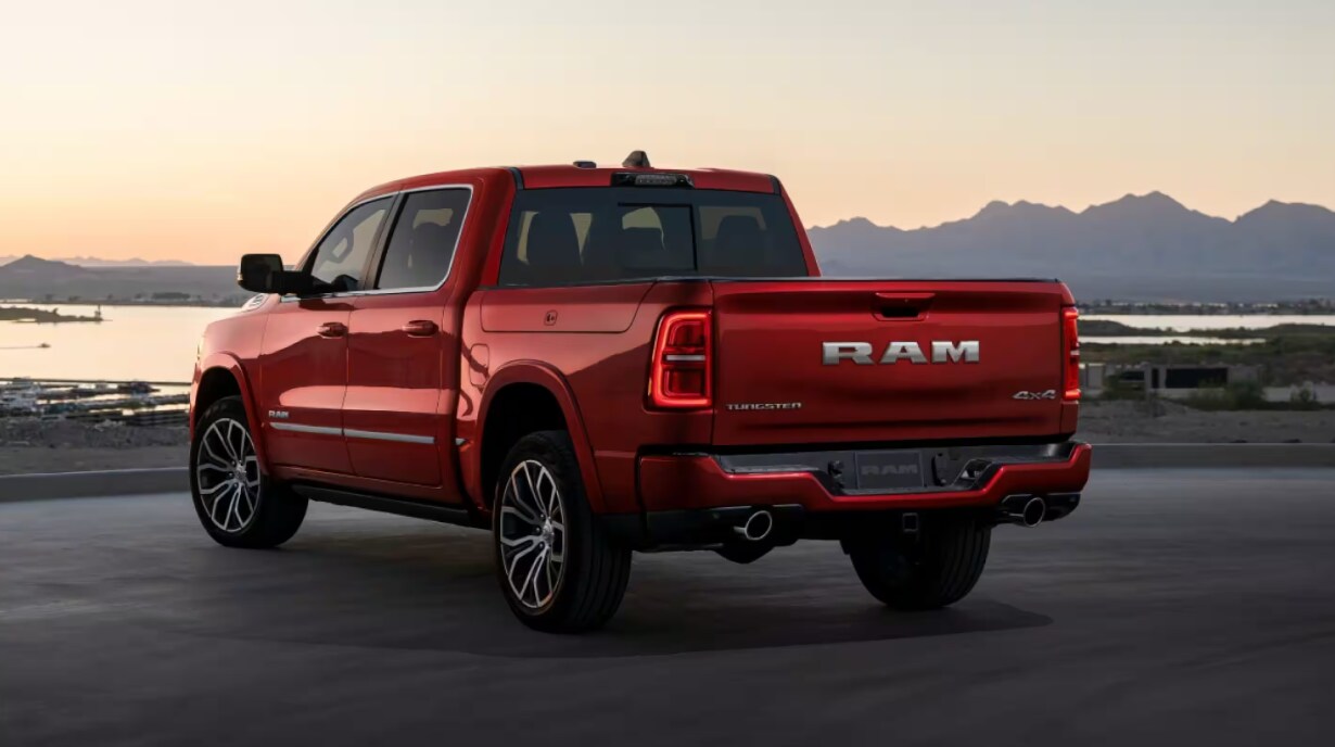 Red 2026 RAM 1500 Red 2026 RAM1500exterior view with a sunset in the background.