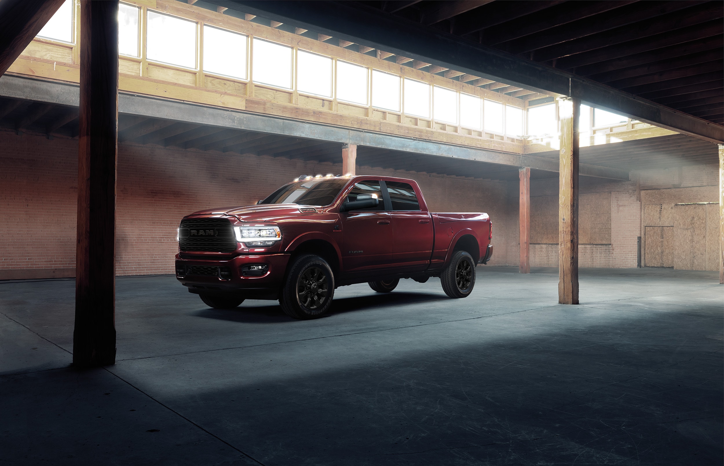 A parked red truck covered by the RAM warranty