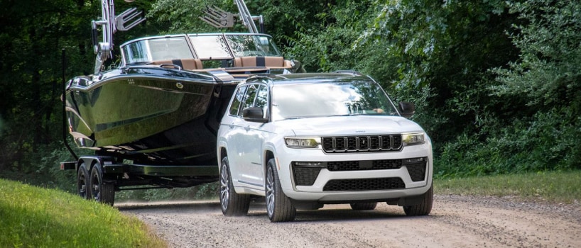 2026 Jeep Grand Cherokee towing boat at A M Maus & Son in Minnesota.