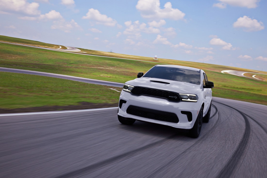 2024_Dodge_Durango_SRT_Hellcat_AWD_driving_on_a_track.png