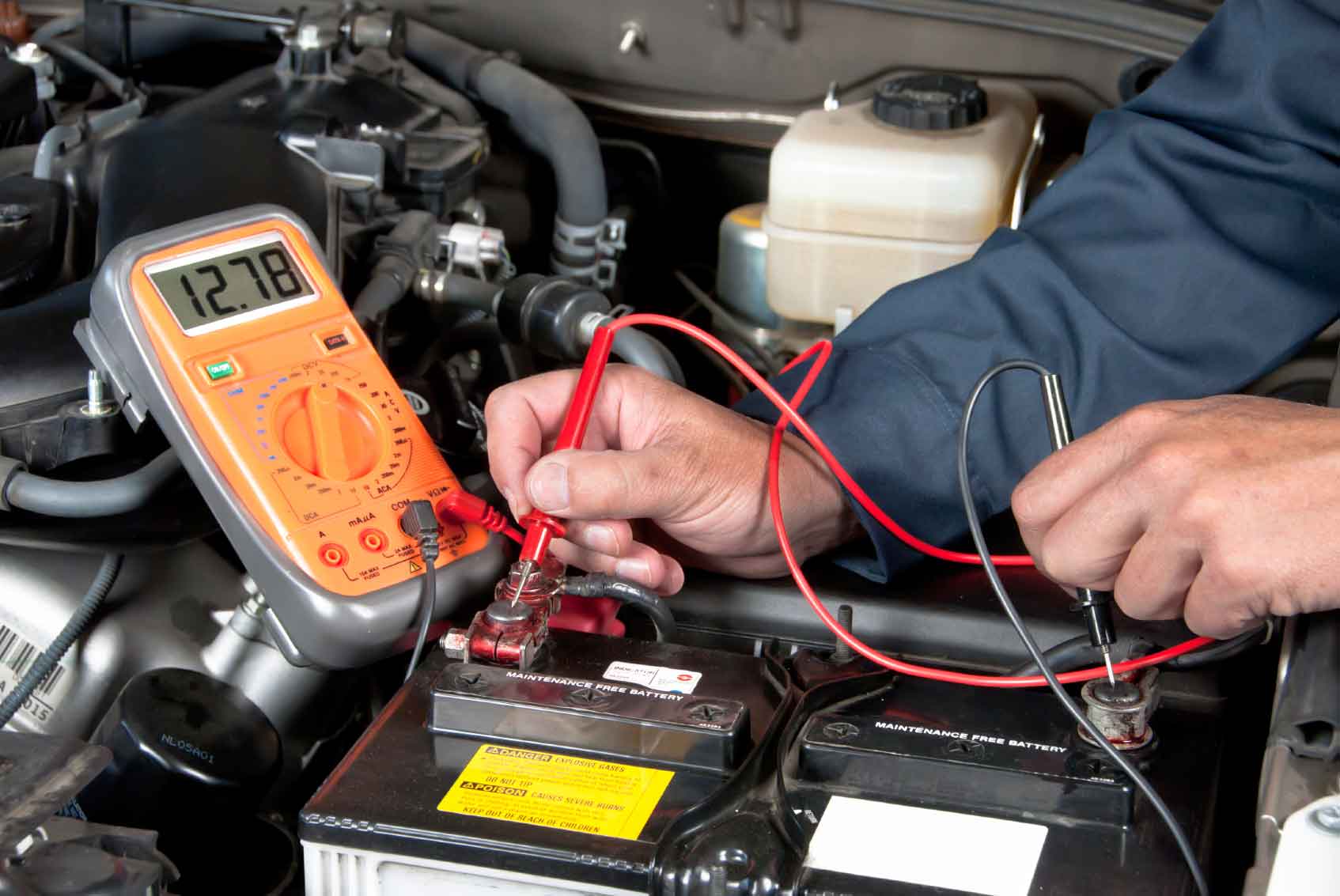 Hyundai service technician testing a battery