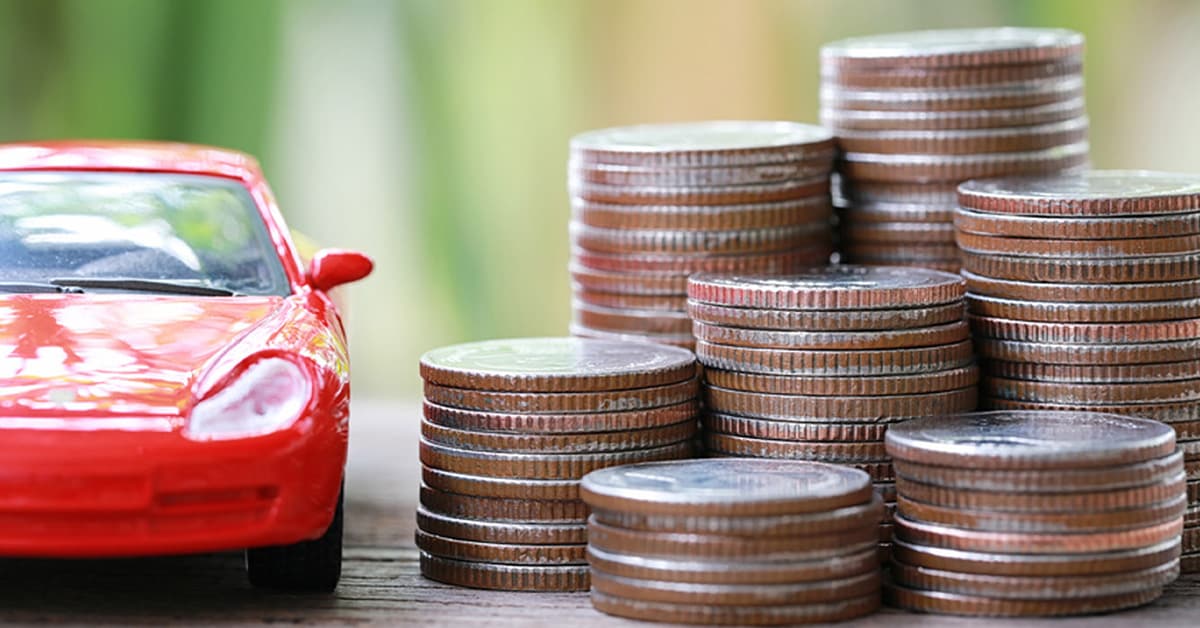 Stacks of coins and toy car representing Hyundai financing