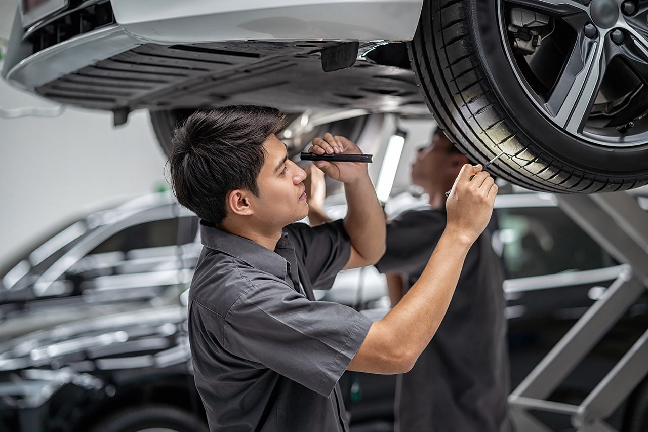 Hyundai tire service technician inspecting a tire