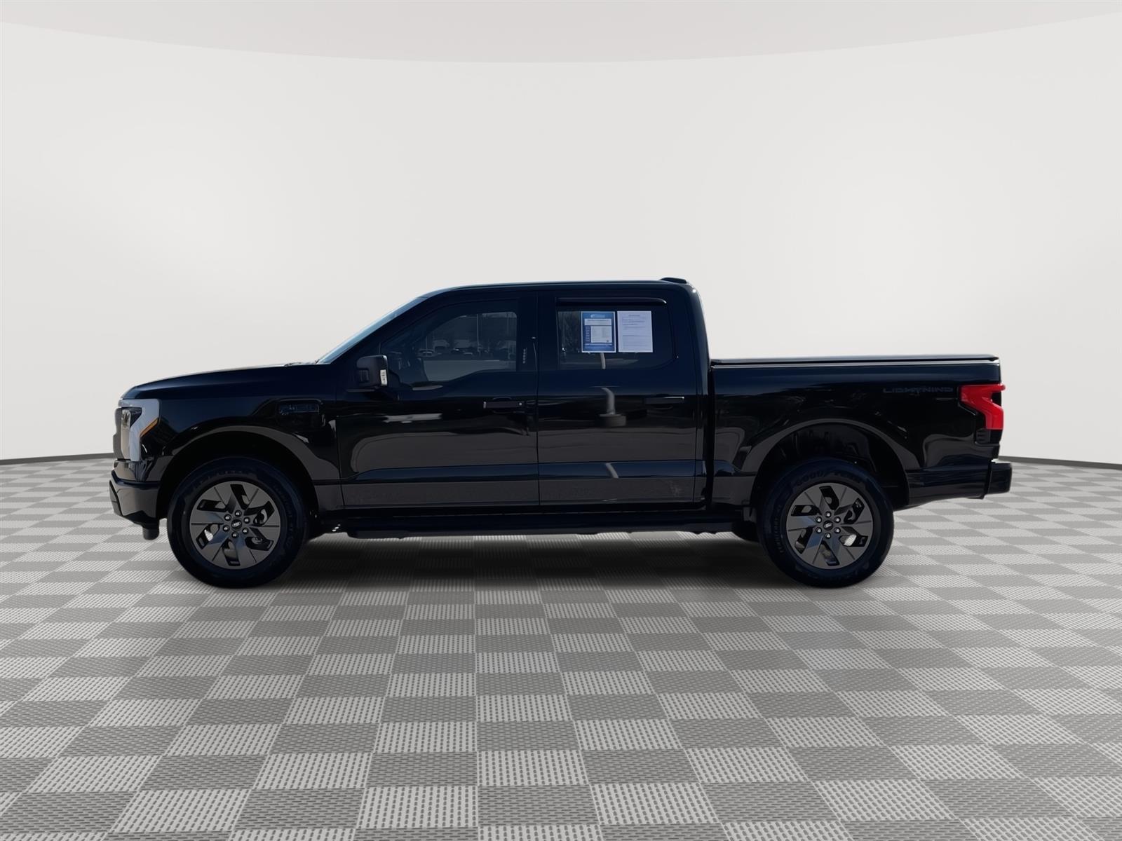 Used 2024 Ford F-150 Lightning XLT with VIN 1FTVW3LK4RWG23053 for sale in Lincoln, NE