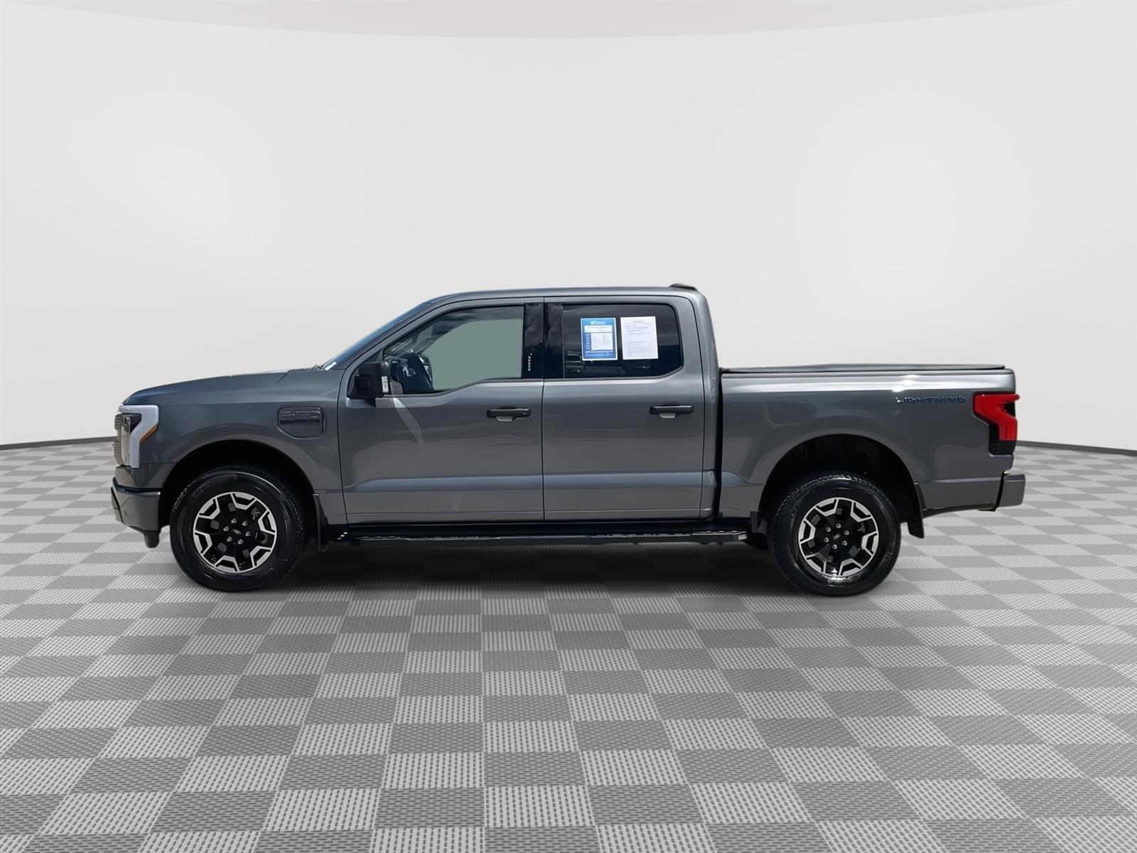 Used 2023 Ford F-150 Lightning XLT with VIN 1FTVW1EL2PWG50646 for sale in Lincoln, NE
