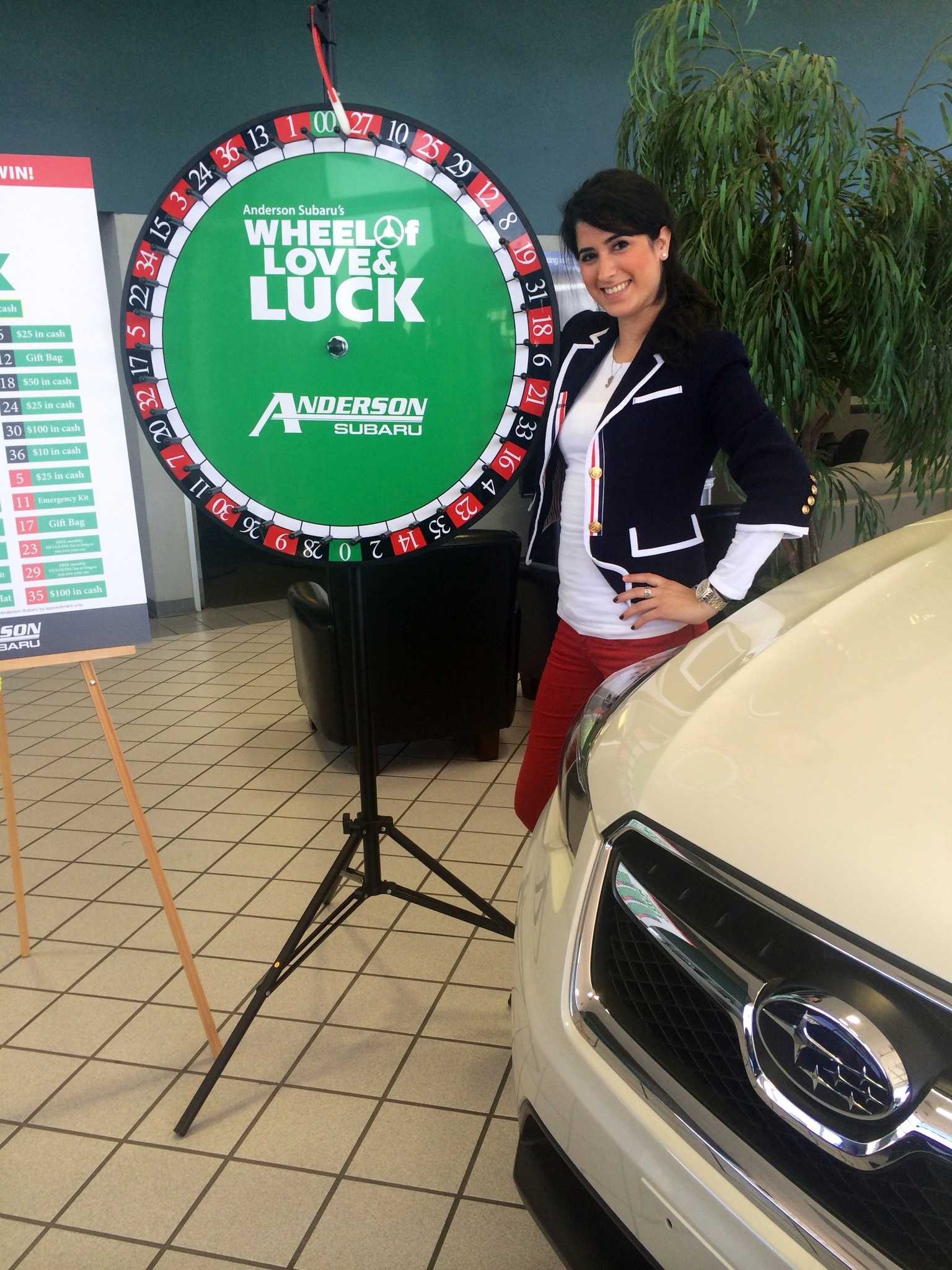The Beautiful Laura Morgenstern with
the Anderson Subaru Wheel of Love and
Luck.jpg