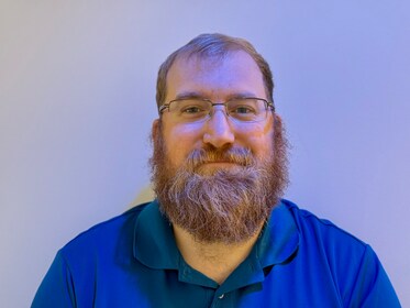 Staff member Andrew Becknell from ID_6482b5