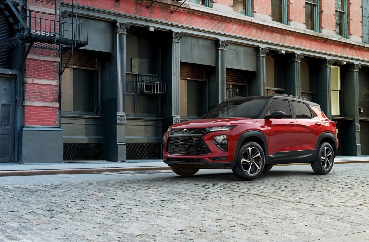 A new red Chevrolet Trailblazer parked on a city street.jpeg