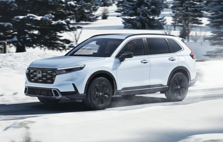 White Honda CR-V driving in the snow.jpeg