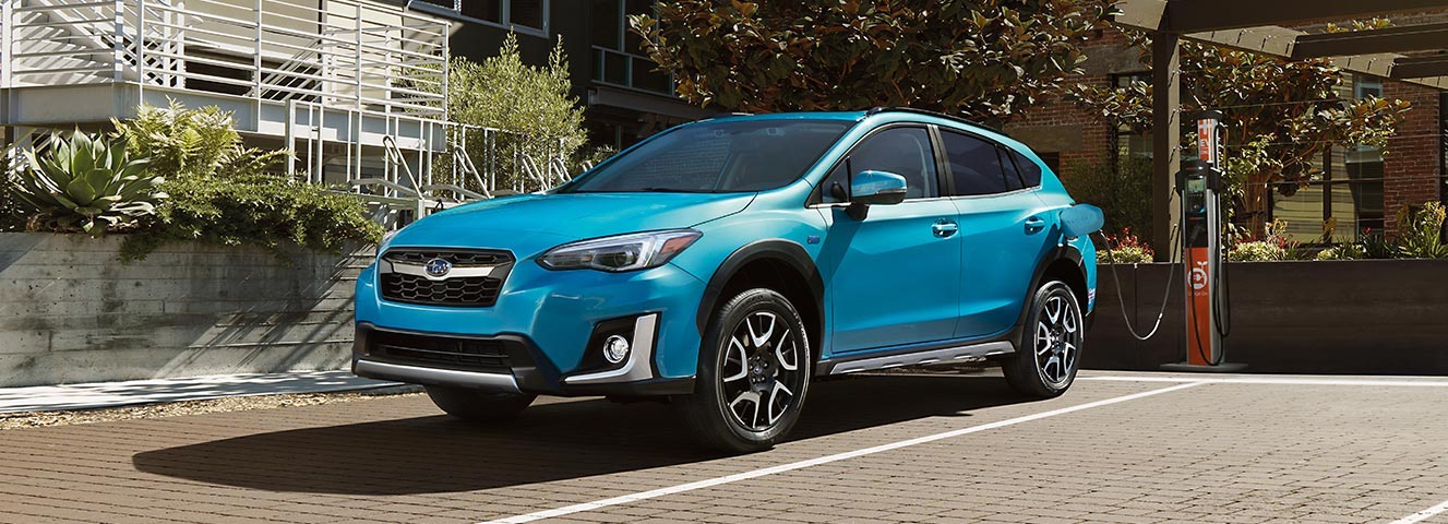 Subaru Crosstrek Hybrid plugged-in at public charging station