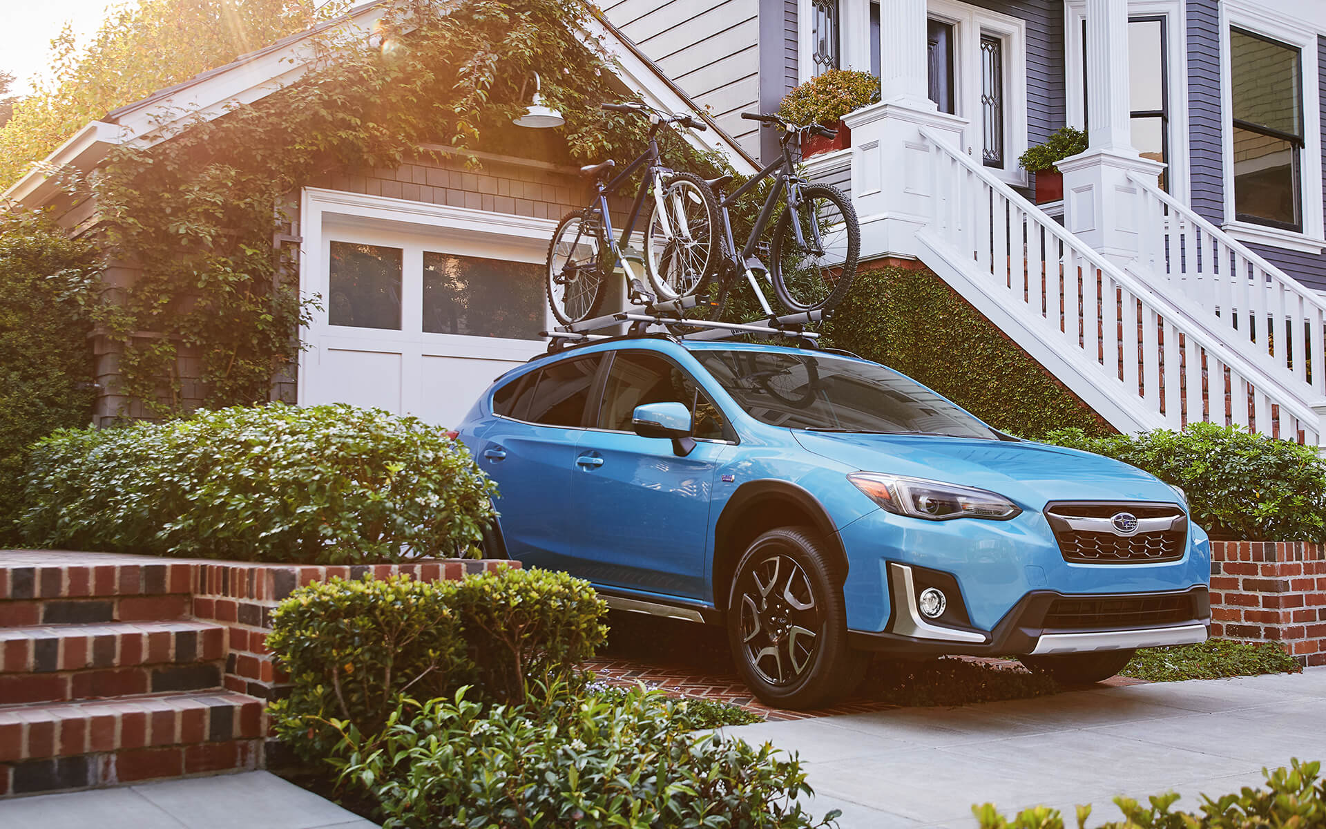 Subaru Crosstrek Hybrid parked outside a home
