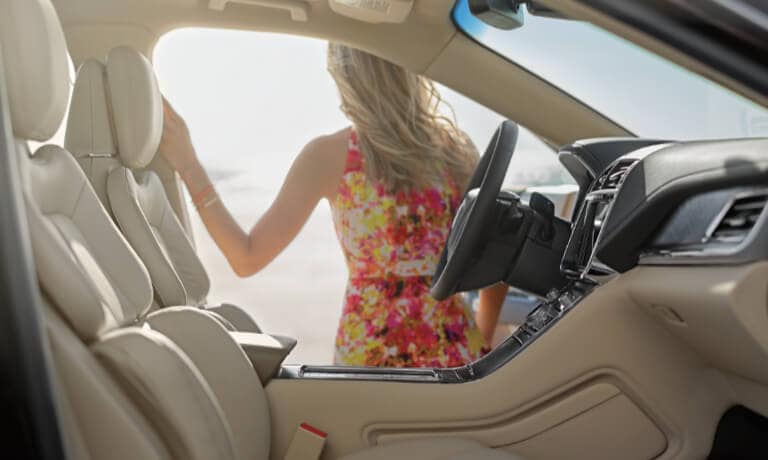2019 Lincoln Continental with door open and women outside
