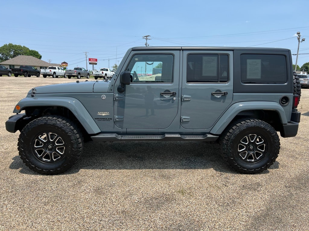 Used 2014 Jeep Wrangler Unlimited Sahara with VIN 1C4BJWEGXEL157717 for sale in Canton, IL