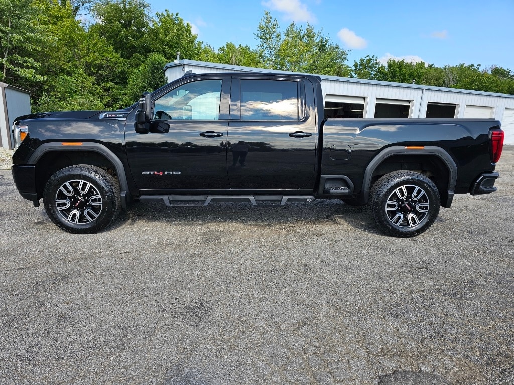 Used 2021 GMC Sierra 2500HD AT4 with VIN 1GT49PE74MF319894 for sale in Canton, IL