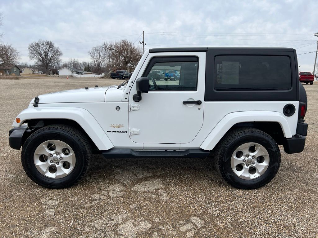 Used 2015 Jeep Wrangler Sahara with VIN 1C4AJWBG7FL772694 for sale in Canton, IL