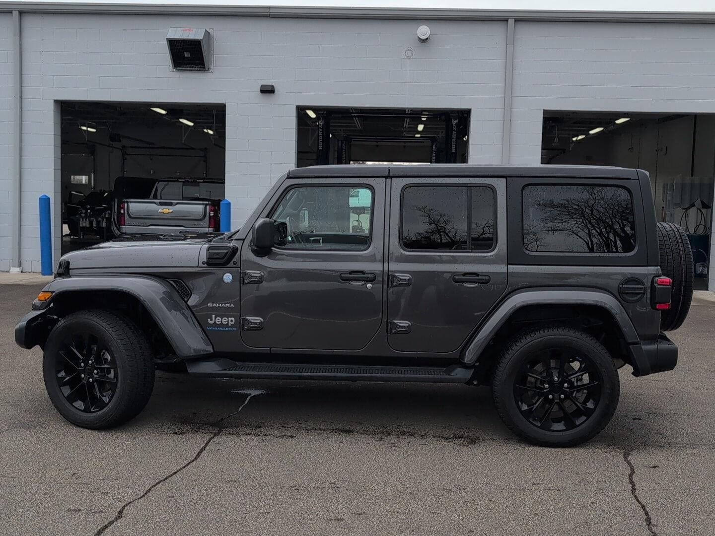 Used 2023 Jeep Wrangler 4xe Sahara 4XE with VIN 1C4JJXP61PW599423 for sale in Jackson, MI