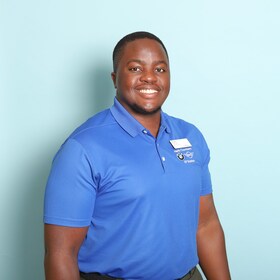 Staff member Alpha Mwesigwa from ID_a4902c