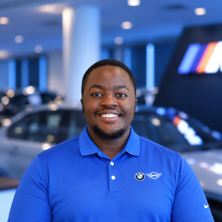 Staff member Alpha Mwesigwa from ID_a4902c