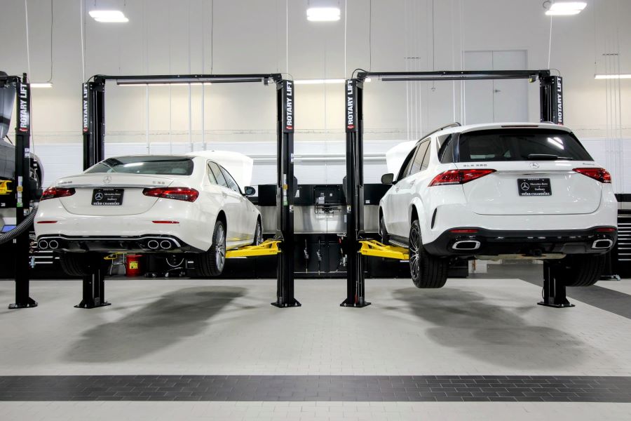  Service attendant helping man into car