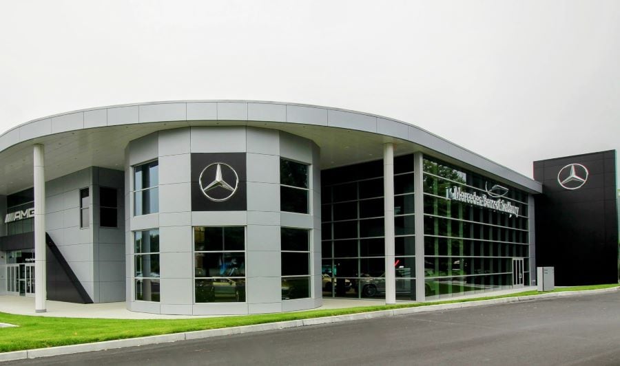  Man and woman walking by car