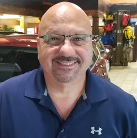 Staff member Gus Dotsikas from 4316c1384fa7