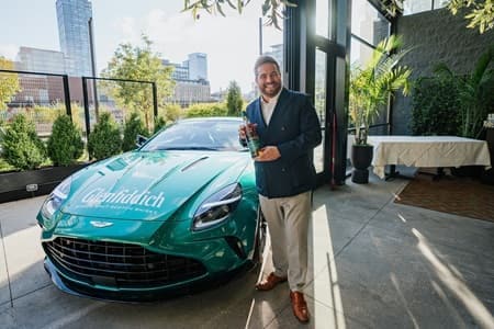 Glenfiddich Whiskey in front of Aston Martin Vantage