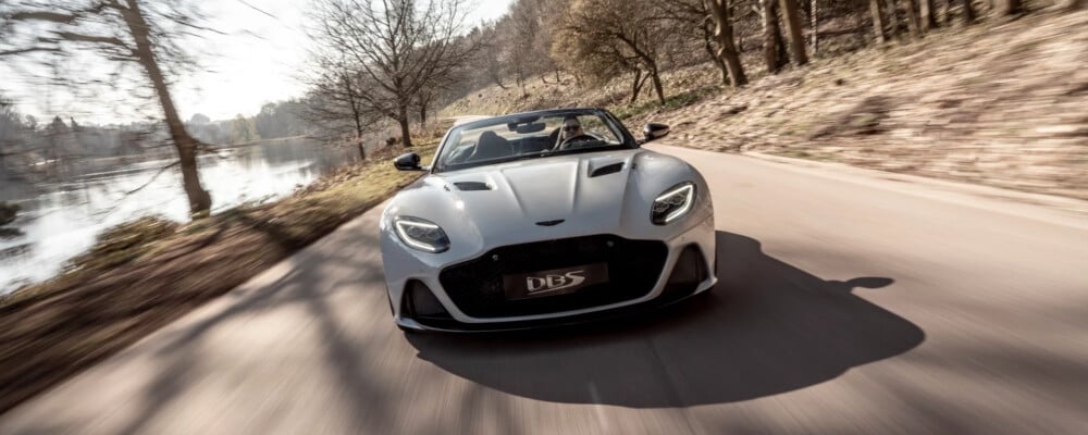 2021 Aston Martin DBS Superleggera driving down a road