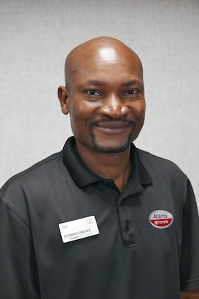 Staff member Thomas Omowa from ID_cc37fda3b719