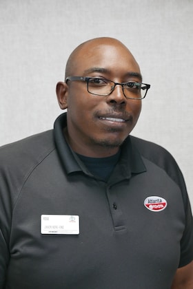 Staff member Jason Senu-Oke from ID_cc37fda3b719