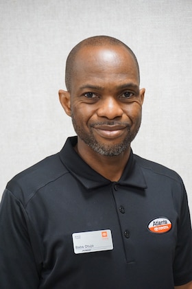 Staff member Babs Otujo from ID_cc37fda3b719