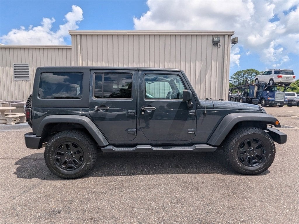 Certified 2017 Jeep Wrangler Unlimited Willys Wheeler with VIN 1C4BJWDG7HL742969 for sale in Saint Augustine, FL