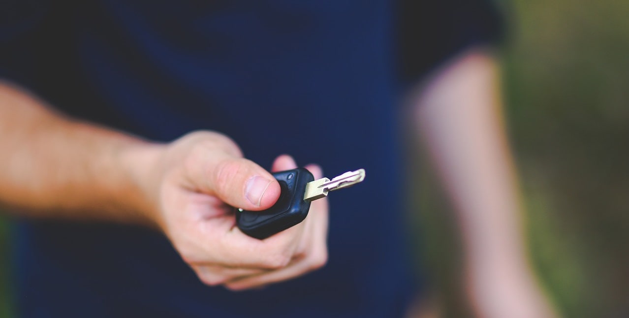 guy handing car keys