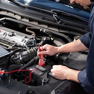 Toyota Technician working on battery