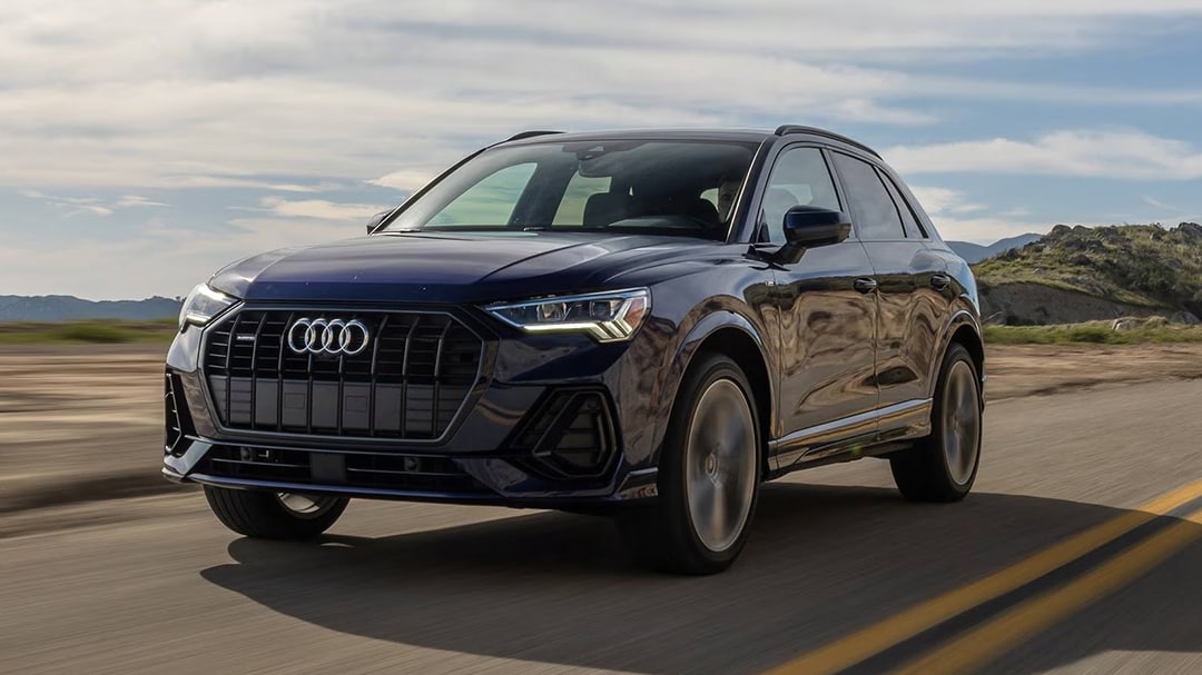 3/4 front and side view of the Audi Q3 2025 on the road at full power