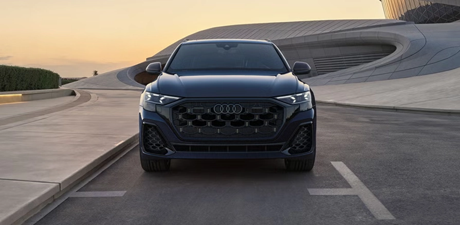 Audi Q8 front with Matrix-design LED headlights illuminated