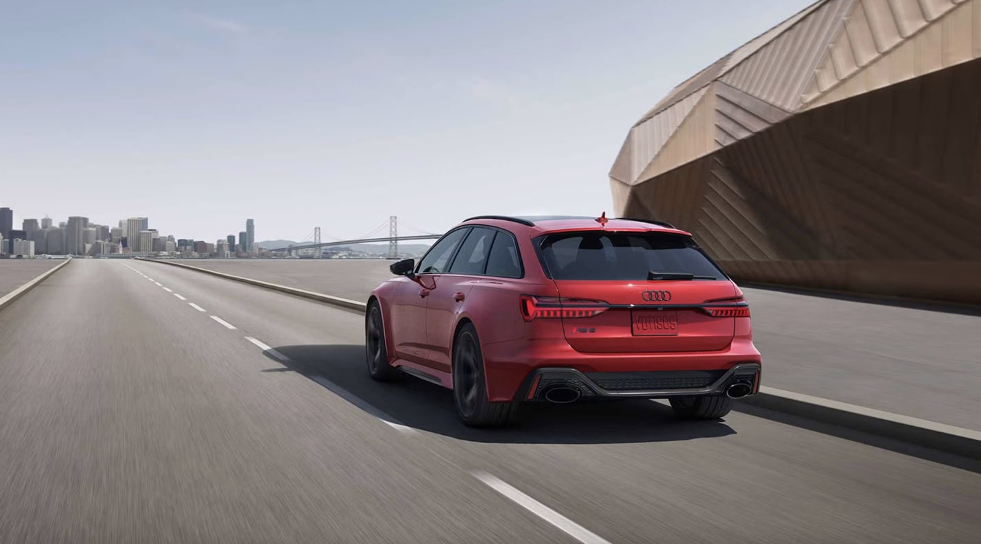 Rear view of the Audi RS 6 Avant driving on an open highway