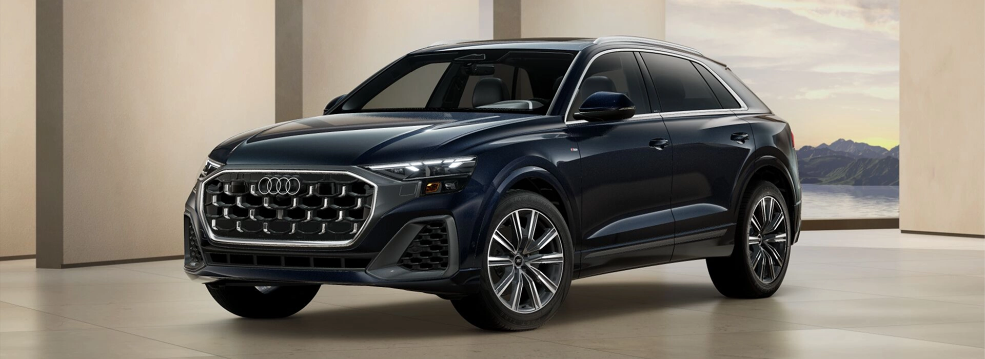 Dark blue Audi Q8 in a studio setting, front three-quarter view
