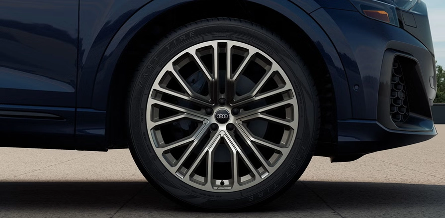 Close-up of an Audi Q8 alloy wheel in neodymium gold finish