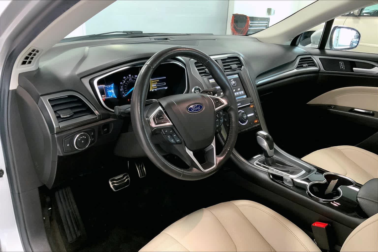 Used 2016 Ford Fusion Titanium with VIN 3FA6P0K98GR301195 for sale in Johnston, IA