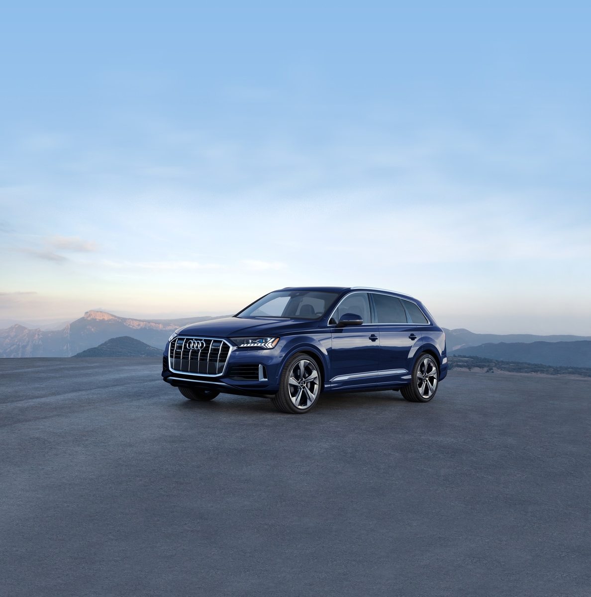 blue Audi Q7 SUV parked in a large open area