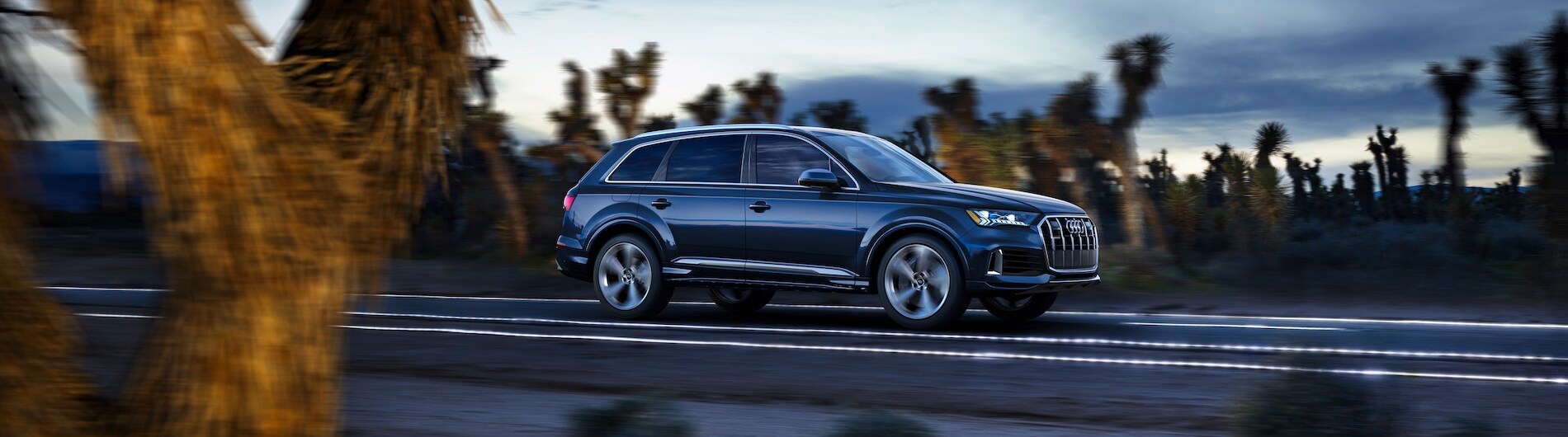 2021 Blue Audi Q7 Driving on the Road