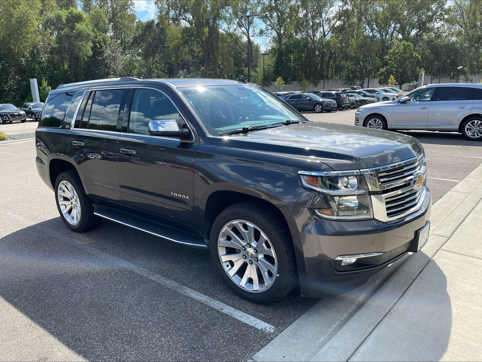 Used 2016 Chevrolet Tahoe LTZ with VIN 1GNSKCKC8GR371626 for sale in Golden Valley, Minnesota