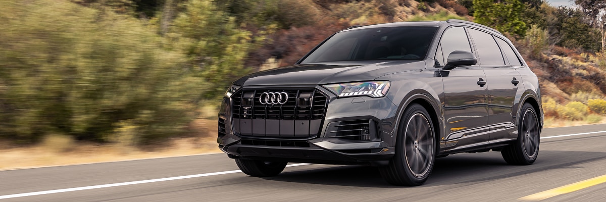 Grey Audi Q7 driving on the road